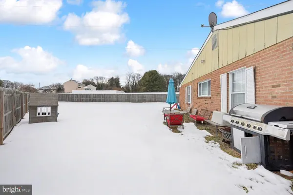 a terrace with outdoor seating and city view