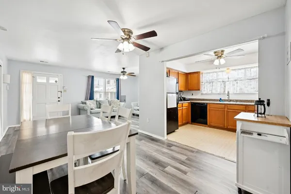 a kitchen with kitchen island a sink stove and refrigerator