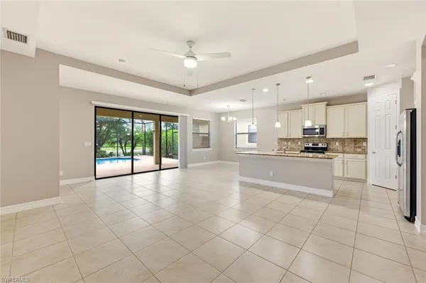 a large kitchen with cabinets and a stainless steel appliances