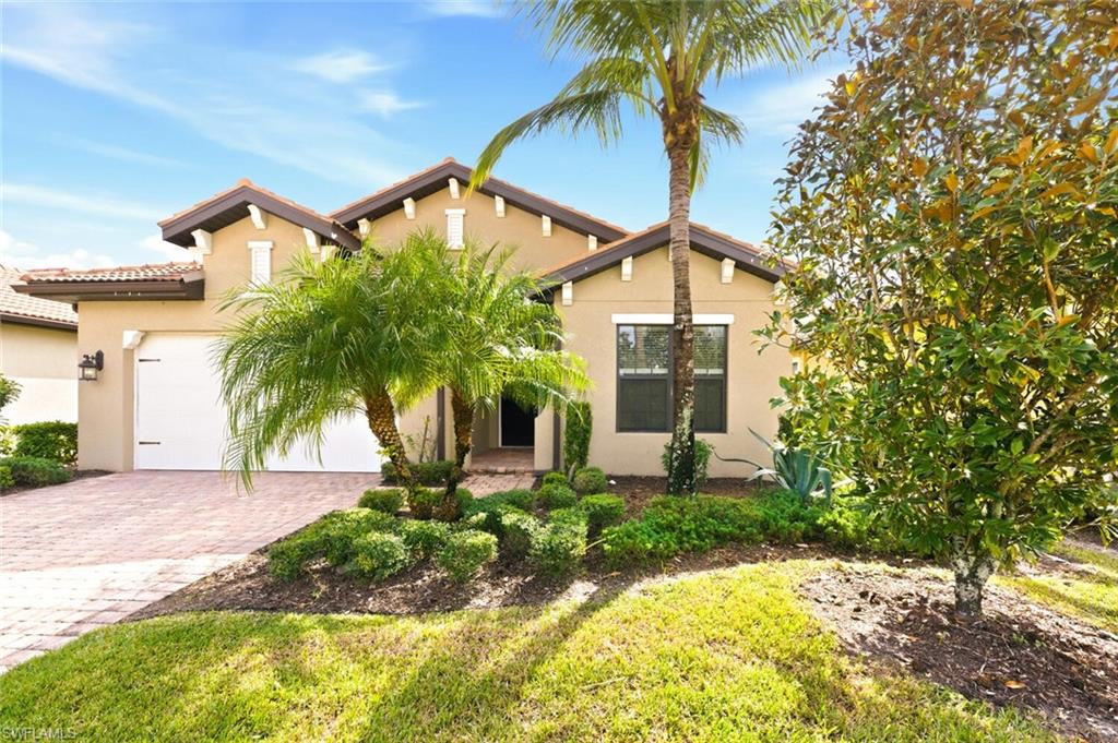 14513 Tuscany Pointe Trail Naples, FL 34120 - Photo 2 of 31 a view of a house with a yard