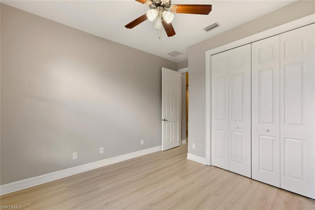 14513 Tuscany Pointe Trail Naples, FL 34120 - Photo 20 of 31 wooden floor in an empty room