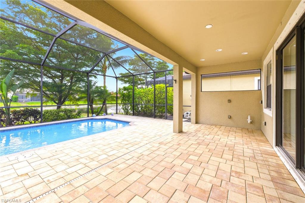 14513 Tuscany Pointe Trail Naples, FL 34120 - Photo 25 of 31 a view of an empty room with a large window