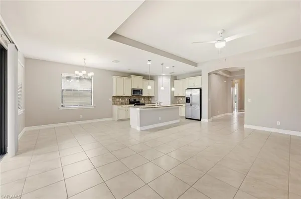 a view of an ocean beach and residential house