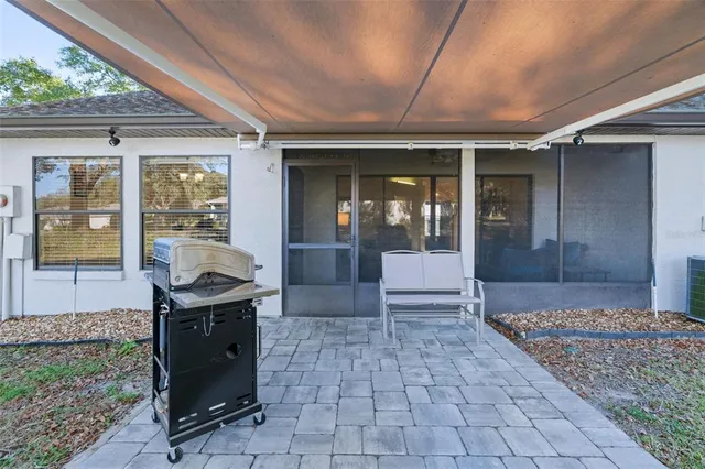 a view of living room with furniture and floor to ceiling window