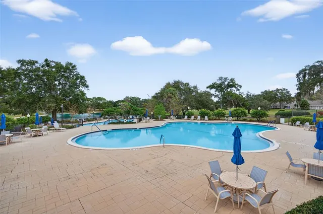 a outdoor dining space with furniture and garden view