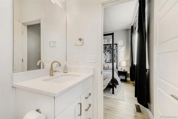 a en suite bathroom with a sink and a mirror