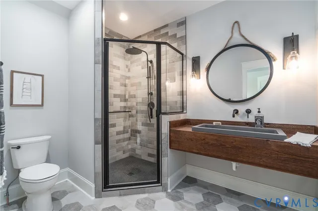 an empty room with furniture and a ceiling fan