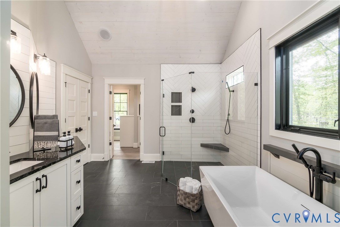 0 Perkinsville Road Maidens, VA 23102 - Photo 24 of 46 a spacious bathroom with a bathtub shower sink and mirror