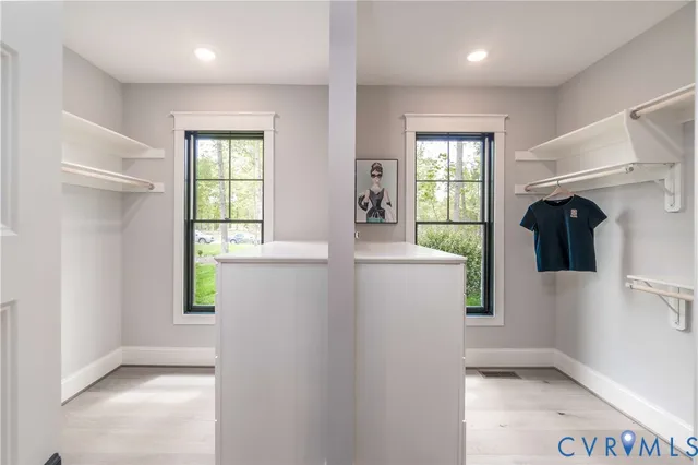 a large kitchen that has a sink and a stove