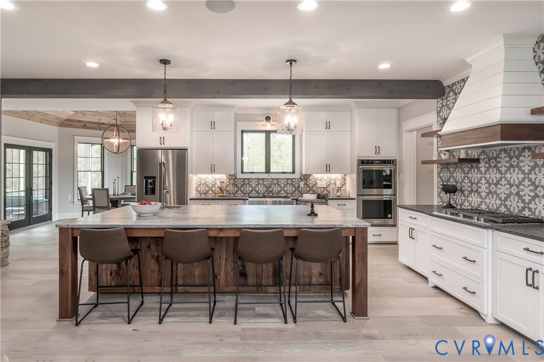0 Perkinsville Road Maidens, VA 23102 - Photo 36 of 46 a kitchen with granite countertop a table and chairs in it