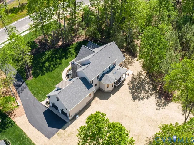 a view of hall way with furniture and chandelier
