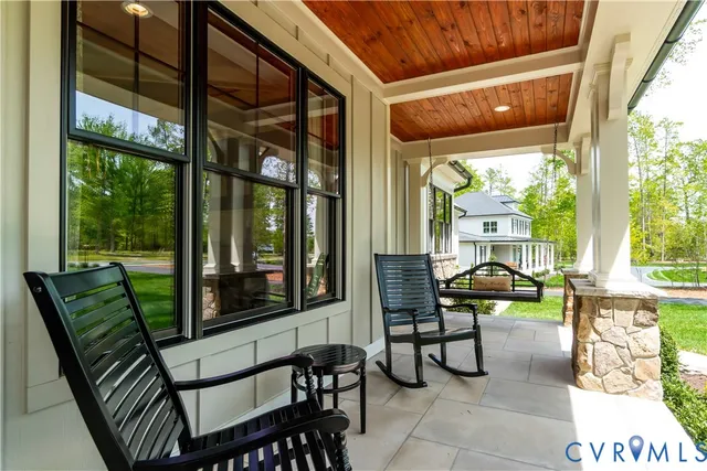 a view of a two chairs in the balcony
