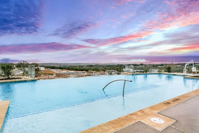 a view of a lake with a table and chairs