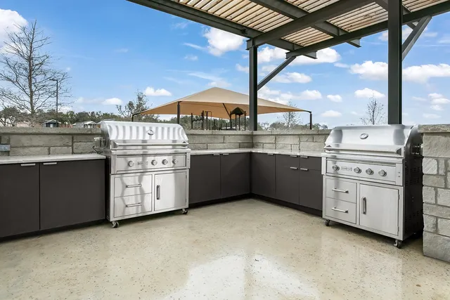 a kitchen with stainless steel appliances granite countertop a stove and a sink