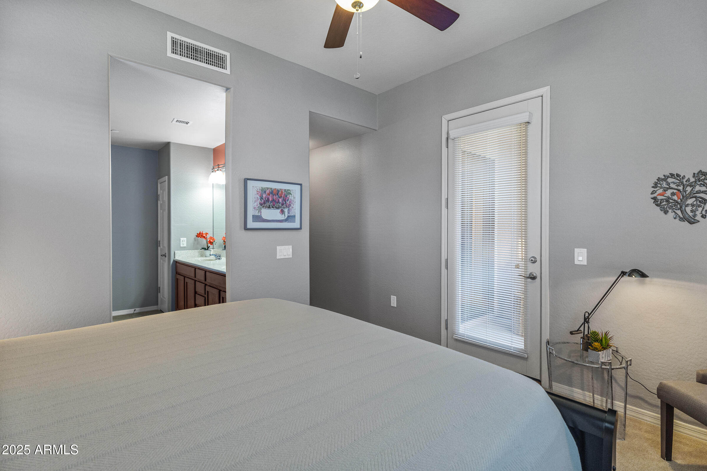 3330 South Gilbert Road, Unit 2013 Chandler, AZ 85286 - Photo 17 of 39 a bedroom with a bed and a chandelier
