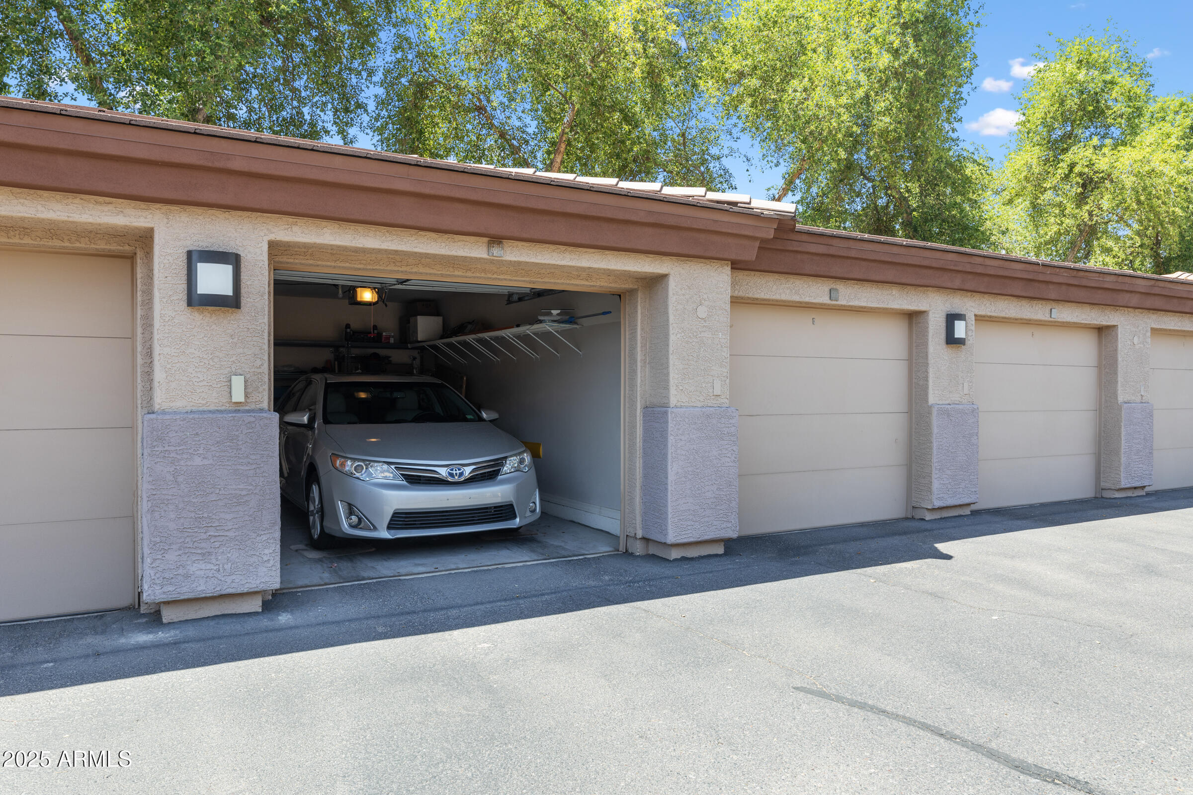 3330 South Gilbert Road, Unit 2013 Chandler, AZ 85286 - Photo 28 of 39 a car parked in front of a house