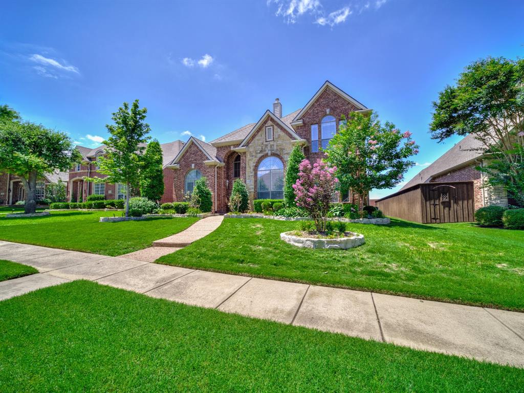 8009 Marathon Drive Plano, TX 75024 - Photo 1 of 1 a front view of a house with a yard and garage