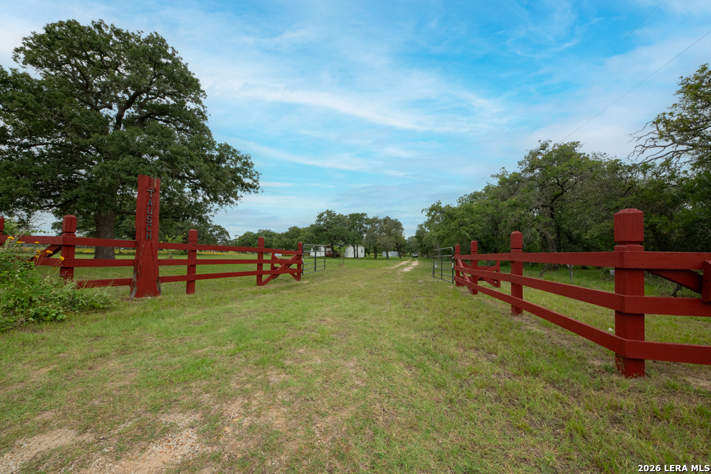 104 Longhorn Road Stockdale, TX 78160 - Photo 16 of 47 a backyard of a house with lots of green space