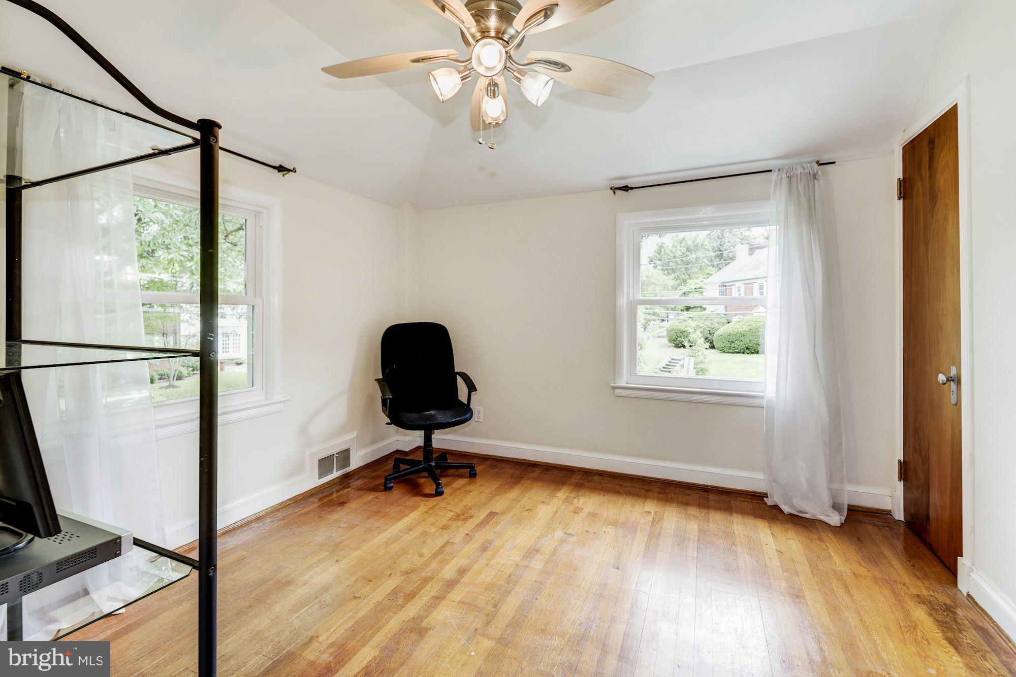 4300 Reno Road Northwest Washington, DC 20008 - Photo 14 of 22 a view of a workspace with furniture and a window