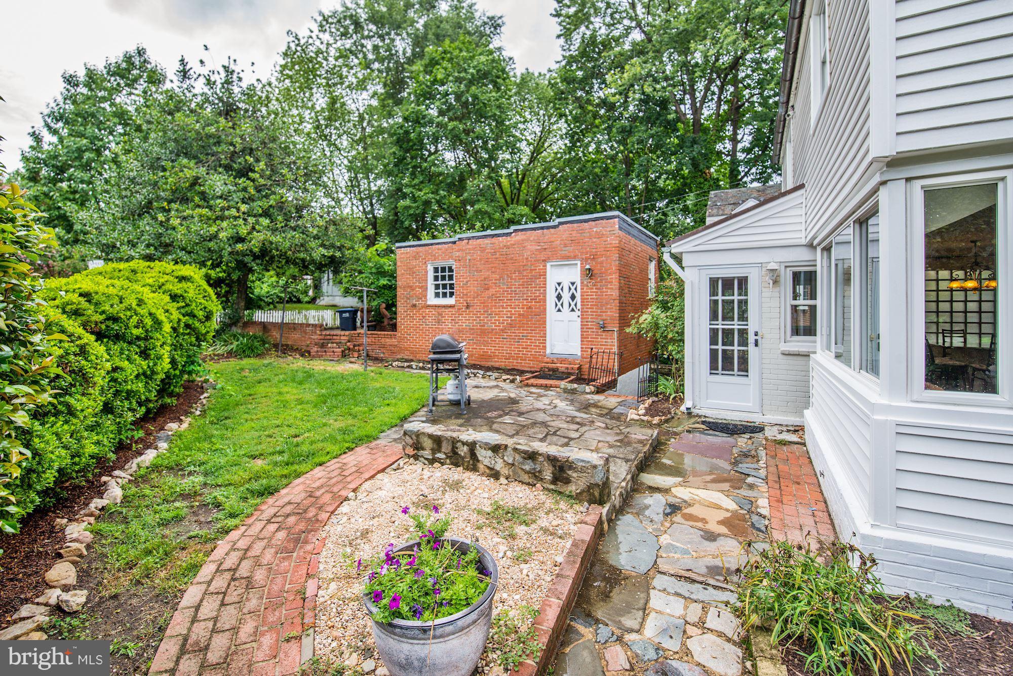 4300 Reno Road Northwest Washington, DC 20008 - Photo 20 of 22 a front view of a house with a yard