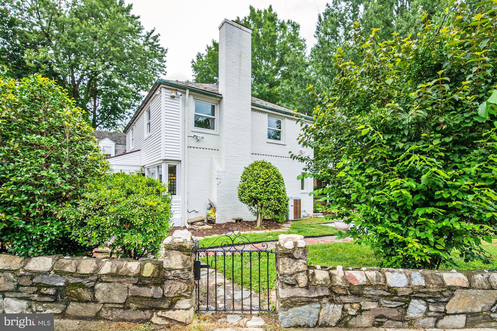 4300 Reno Road Northwest Washington, DC 20008 - Photo 22 of 22 a front view of a house with garden