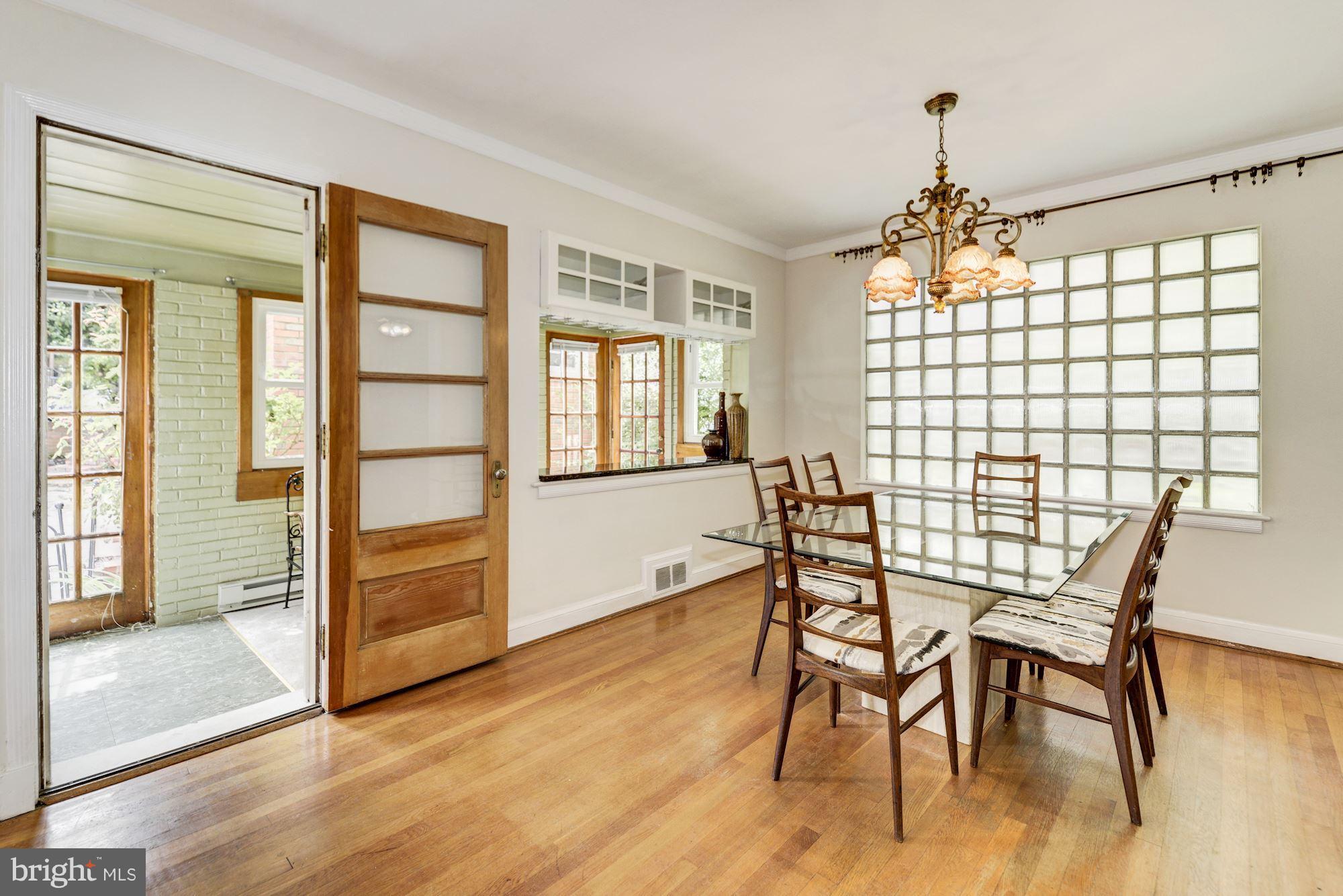 4300 Reno Road Northwest Washington, DC 20008 - Photo 4 of 22 a view of a dining room with furniture window and wooden floor