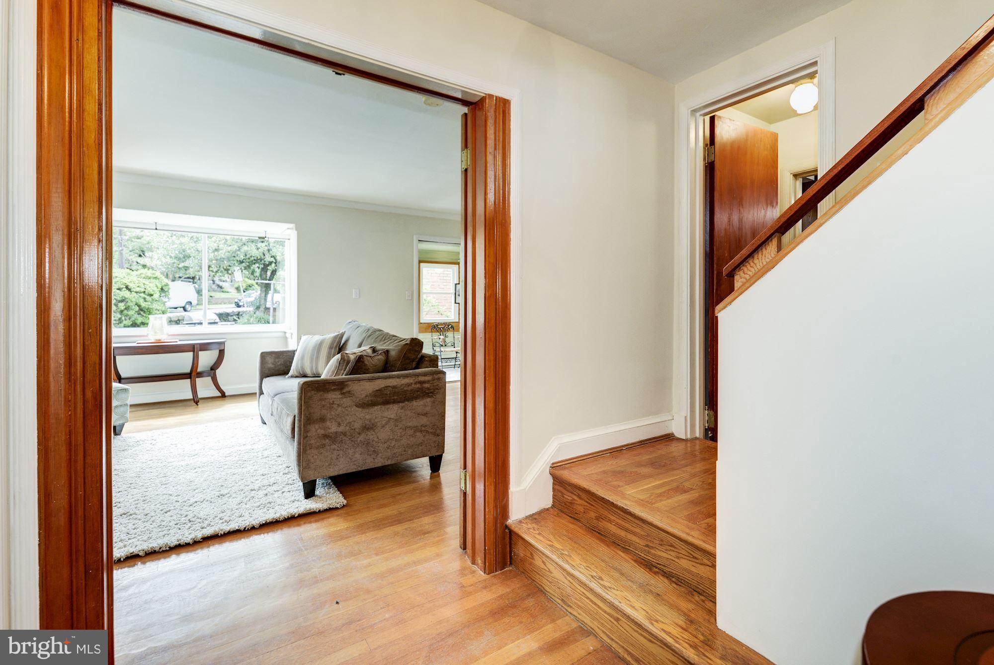 4300 Reno Road Northwest Washington, DC 20008 - Photo 10 of 22 a living room with furniture and a floor to ceiling window