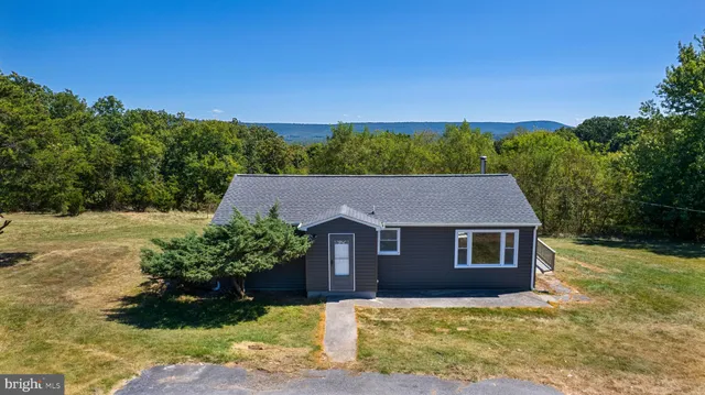 a house with trees in the background