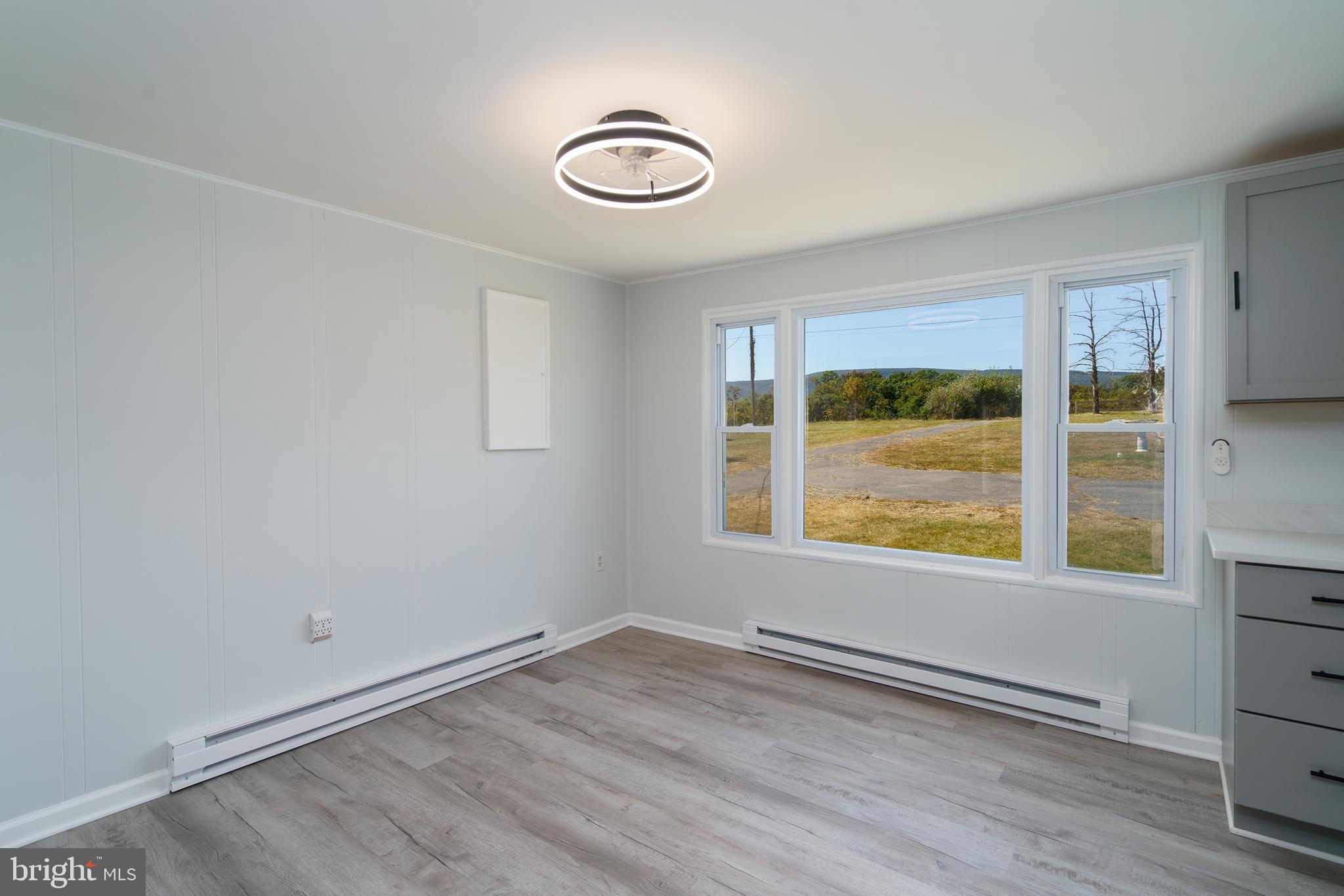 5781 Timber Ridge Road Berkeley Springs, WV 25411 - Photo 15 of 25 an empty room with a window