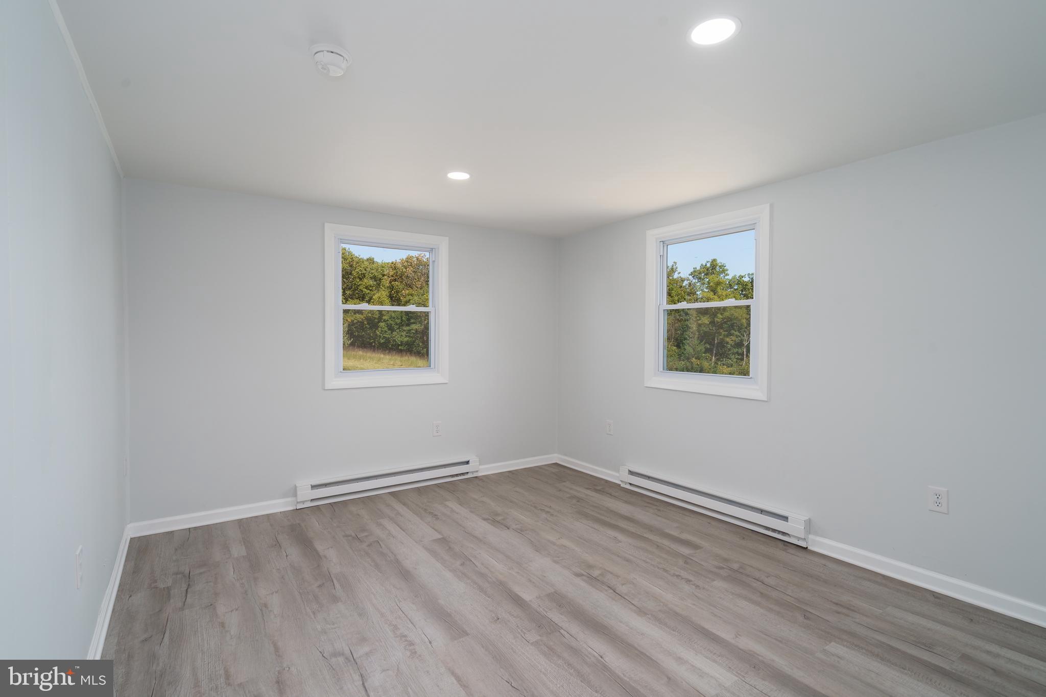 5781 Timber Ridge Road Berkeley Springs, WV 25411 - Photo 21 of 25 an empty room with a window