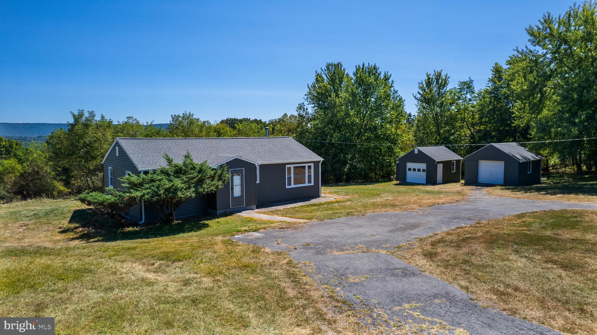 5781 Timber Ridge Road Berkeley Springs, WV 25411 - Photo 5 of 25 a house view with a garden space