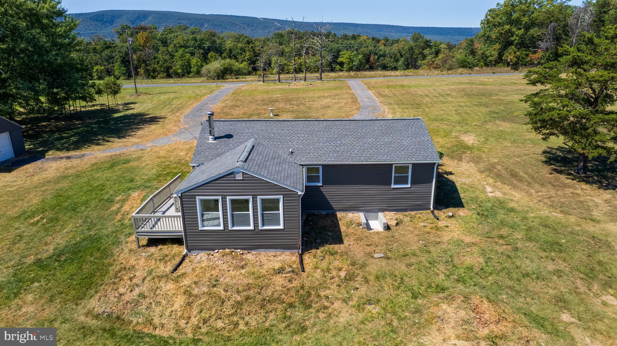 5781 Timber Ridge Road Berkeley Springs, WV 25411 - Photo 6 of 25 a aerial view of a house with a yard
