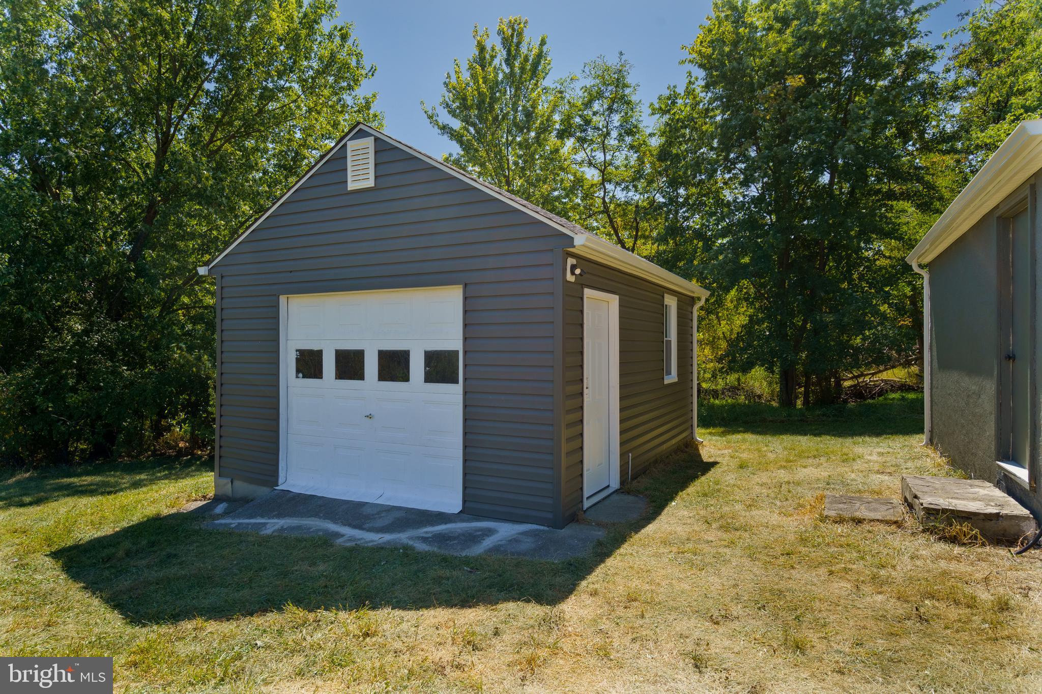 5781 Timber Ridge Road Berkeley Springs, WV 25411 - Photo 9 of 25 a view of house with backyard space and garden
