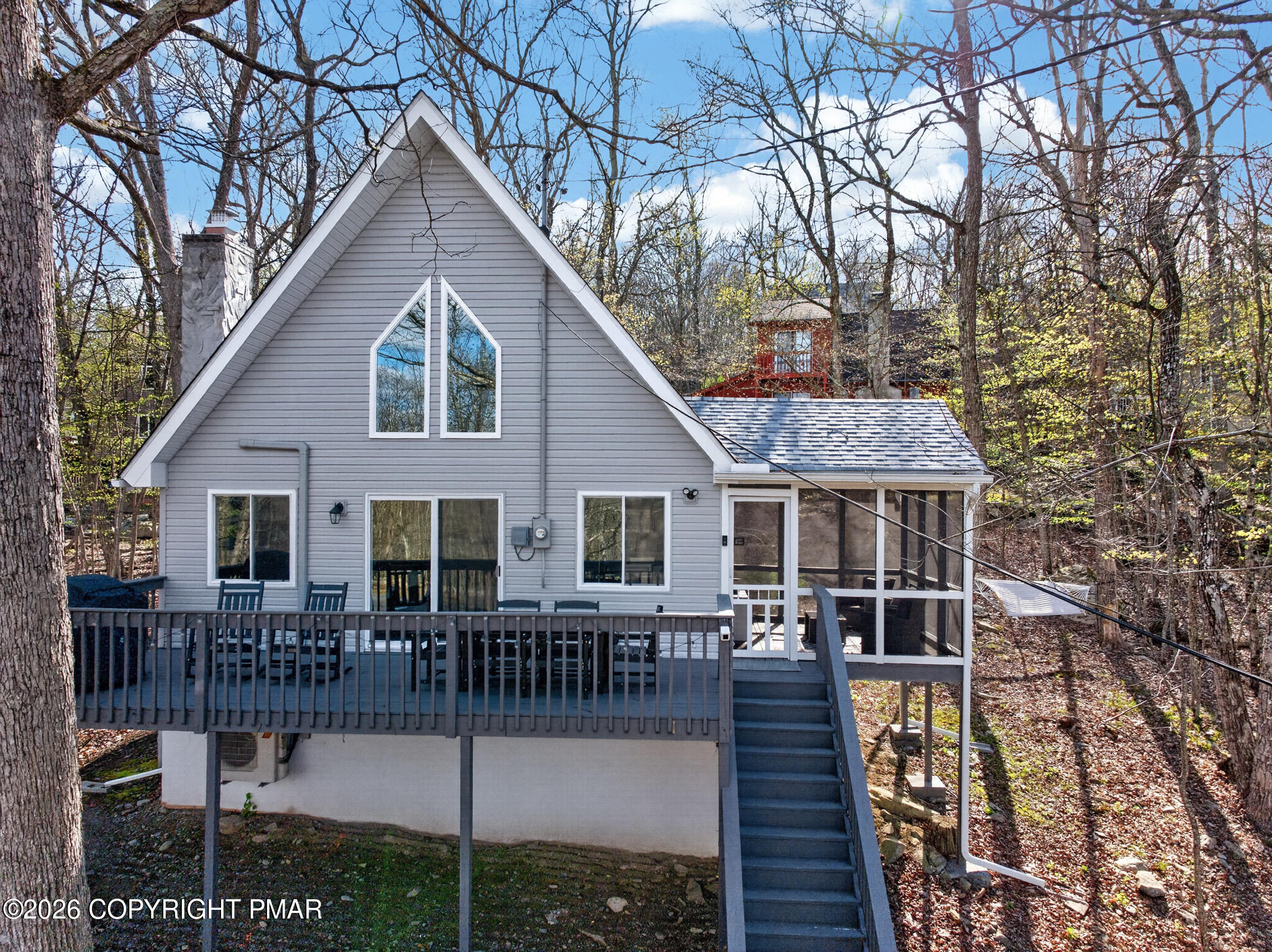 3166 Cherry Ridge Road Bushkill, PA 18324 - Photo 2 of 43 a front view of house yard and balcony