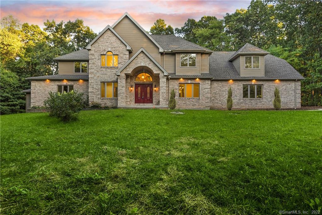 a front view of a house with a yard