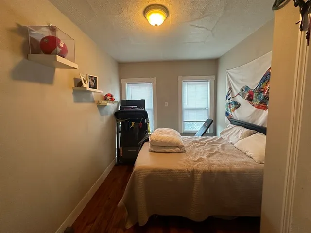 a bedroom with a bed and furniture