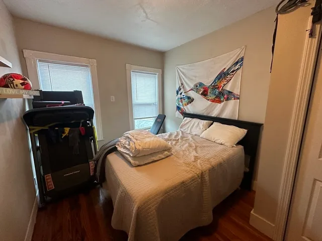 a bedroom with a bed and a closet
