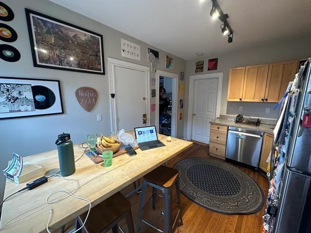 a dining room with furniture and window