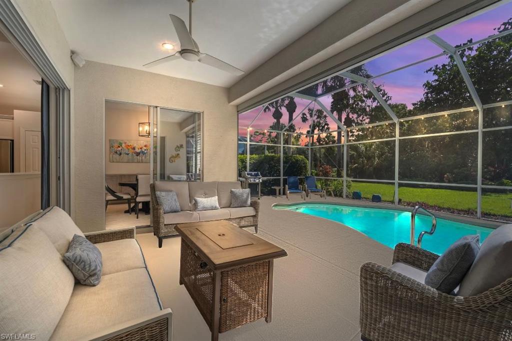 20117 Seadale Court Estero, FL 33928 - Photo 2 of 34 Screened lanai featuring a ceiling fan, recessed lighting, and a built-in pool with steps