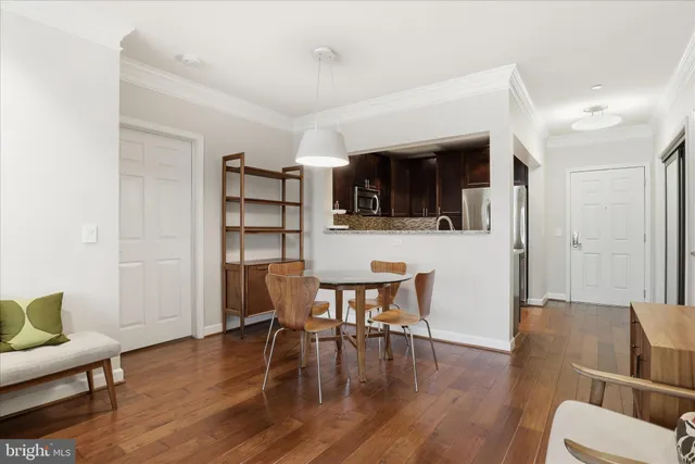 a view of a dining room with furniture and wooden floor