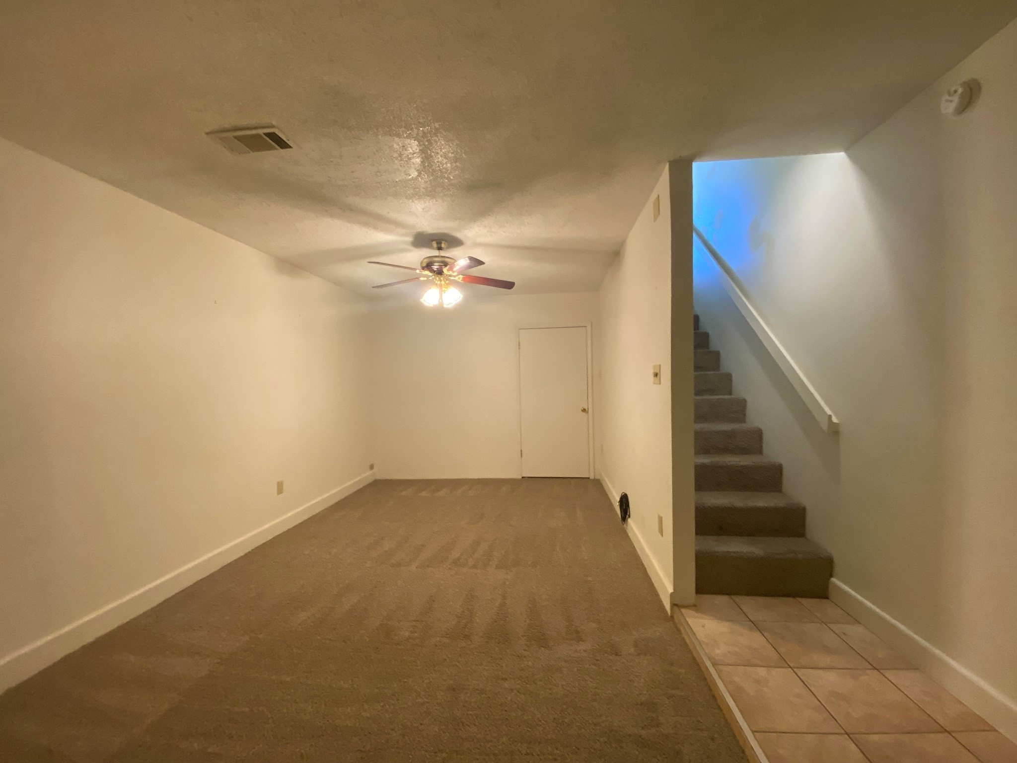 501 Bass Boat Village, Unit 106 Point Blank, TX 77364 - Photo 2 of 7 a view of a hallway with stairs