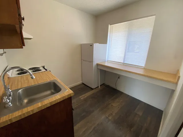a kitchen that has a sink and a stove