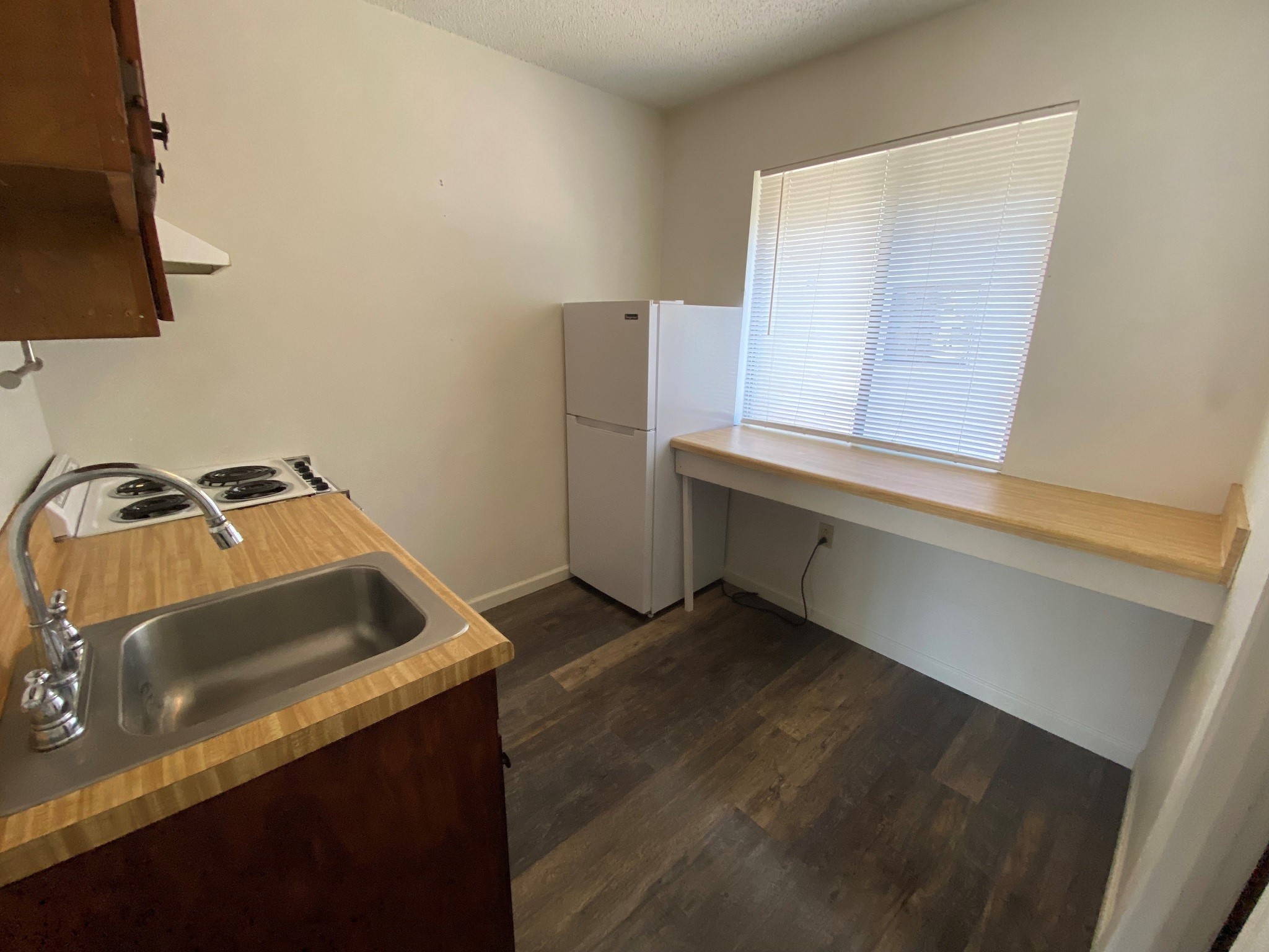 501 Bass Boat Village, Unit 106 Point Blank, TX 77364 - Photo 6 of 7 a kitchen that has a sink and a stove
