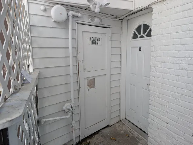 a view of a hallway with windows