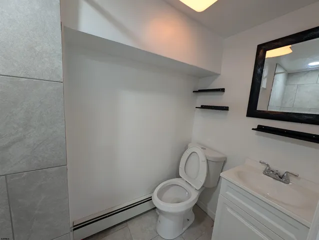 a view of a house with wooden fence