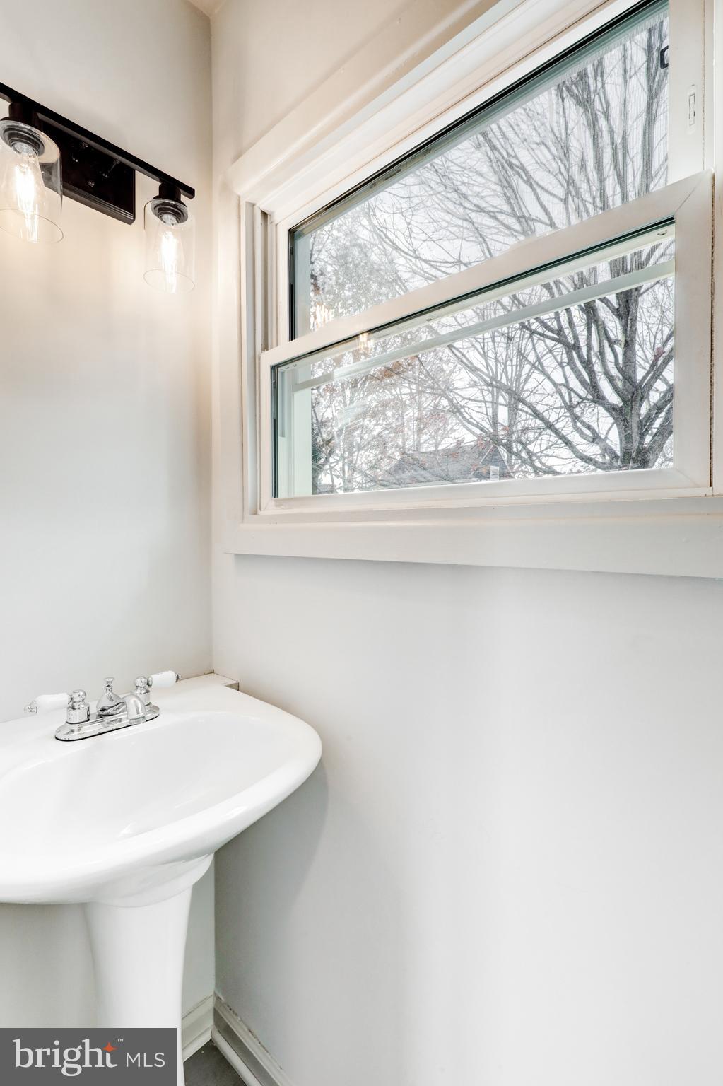 1081 Wynnwood Road Abington, PA 19001 - Photo 17 of 45 a bathroom with a sink and a mirror