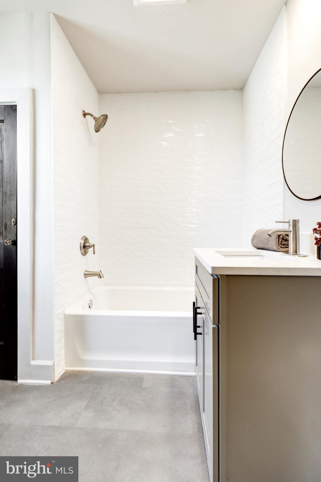 1081 Wynnwood Road Abington, PA 19001 - Photo 23 of 45 a bathroom with a bathtub and a sink