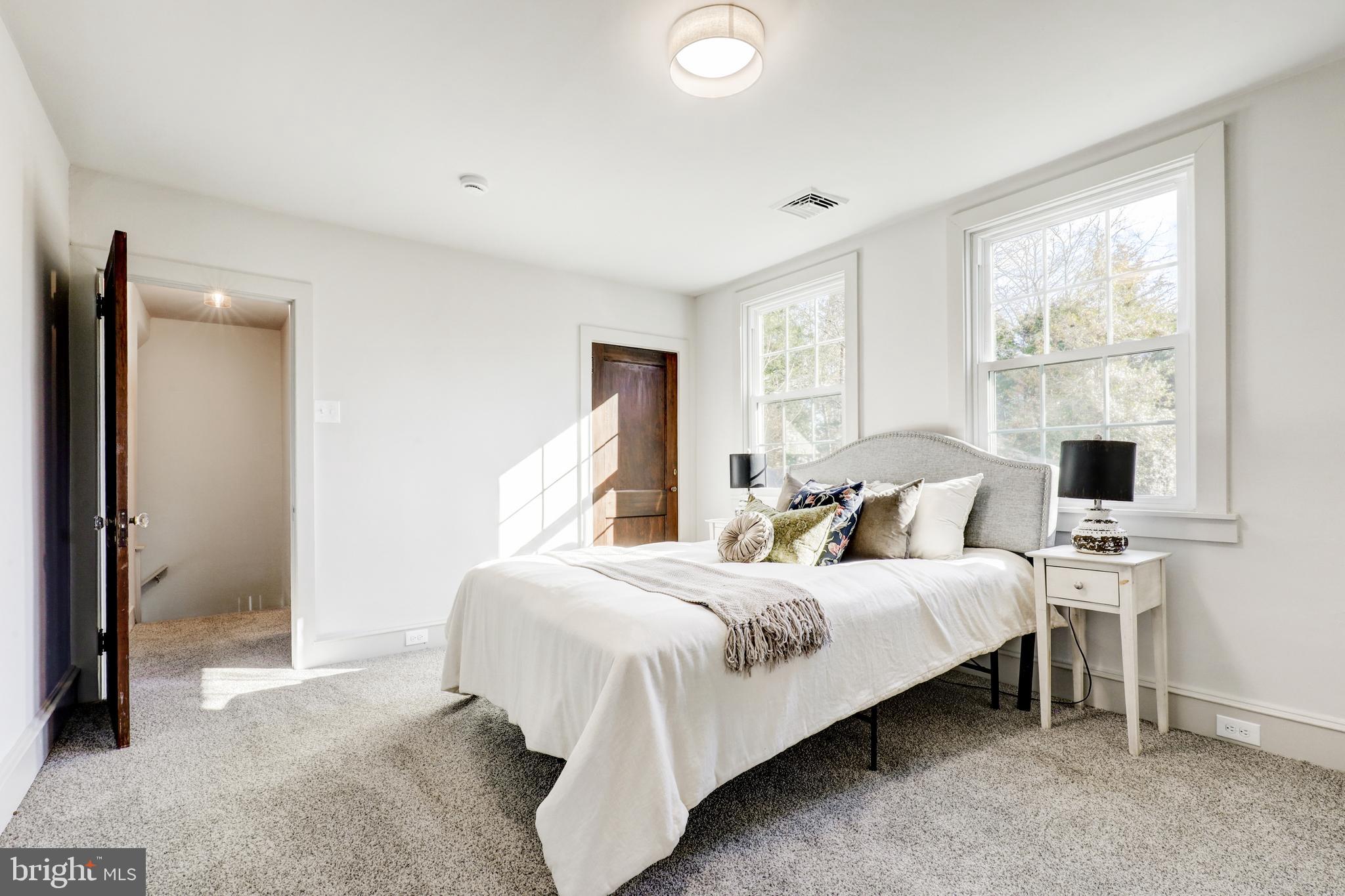 1081 Wynnwood Road Abington, PA 19001 - Photo 30 of 45 a bedroom with bed and a night stand