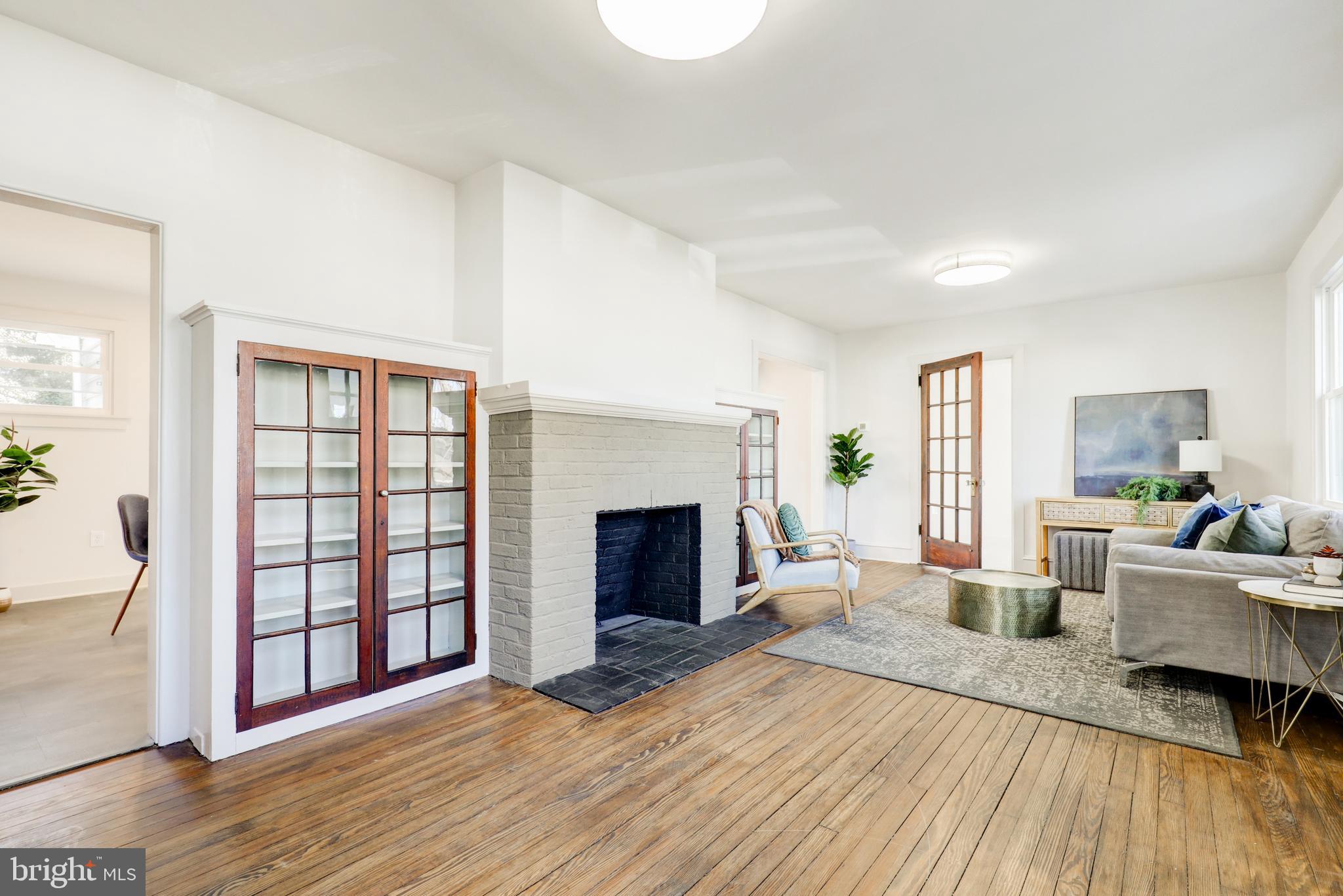 1081 Wynnwood Road Abington, PA 19001 - Photo 3 of 45 a living room with furniture and a fireplace
