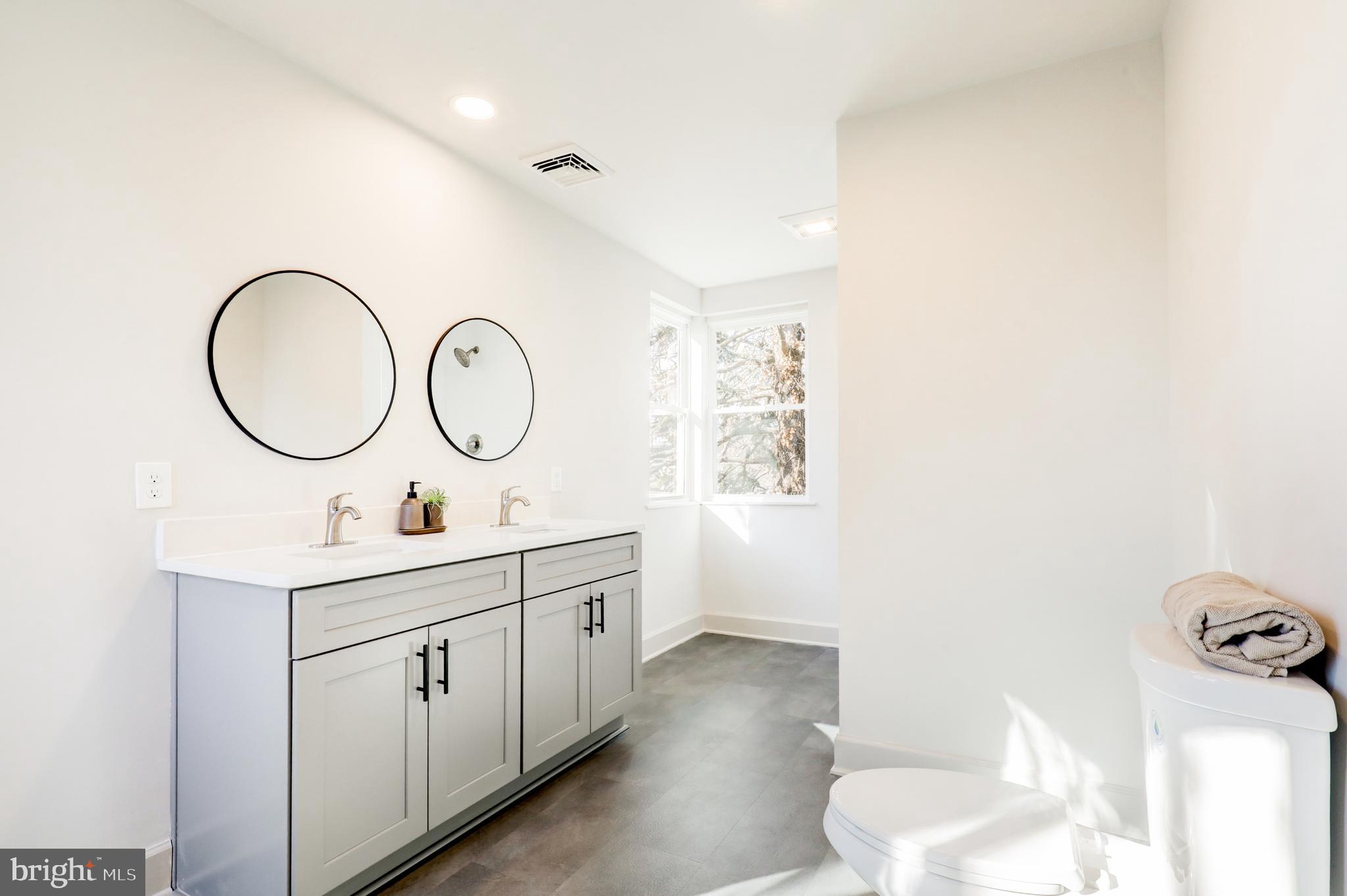 1081 Wynnwood Road Abington, PA 19001 - Photo 31 of 45 a bathroom with a sink and a mirror